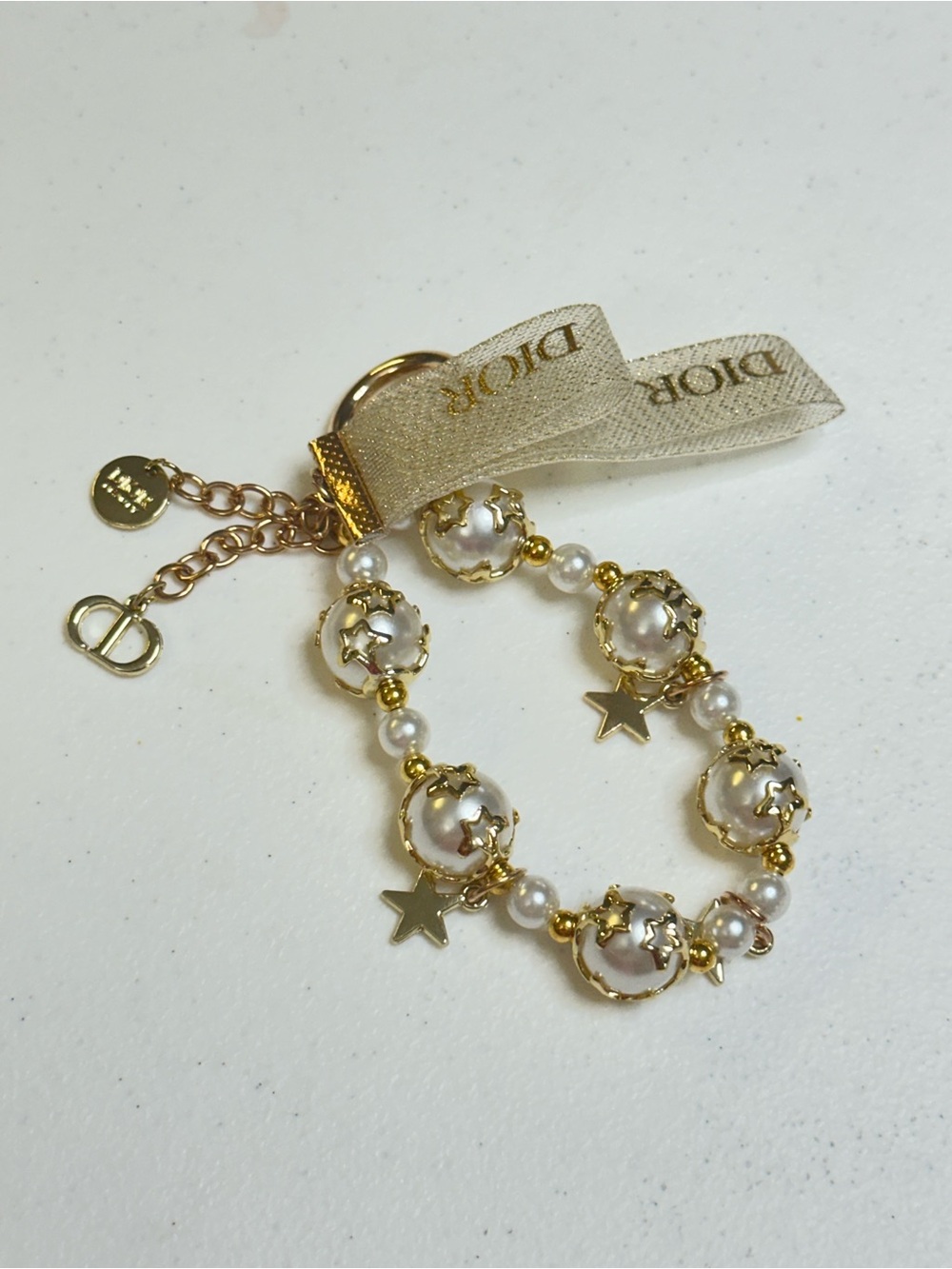 Dior White Pearl & Gold Star Charm Bracelet Keyring